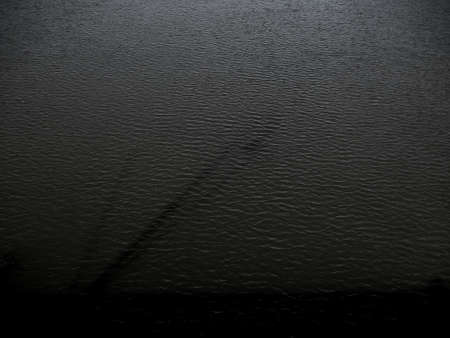grunge dark black water texture useful as a backgroundの写真素材