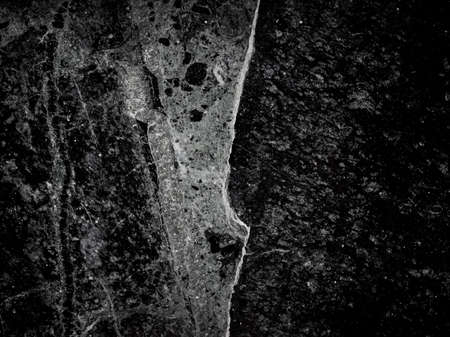 dark grunge stone texture useful as a backgroundの写真素材