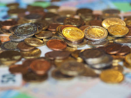 Euro banknotes and coins (EUR), currency of European Union selective focus