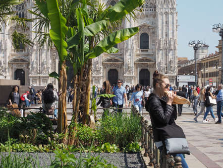 MILAN, ITALY - CIRCA APRIL 2018: People in Piazza Duomo in front of Duomo di Milano (meaning Milan...