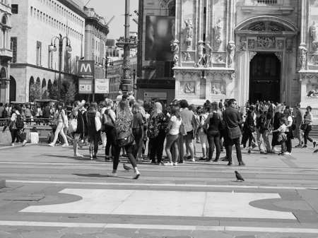 MILAN, ITALY - CIRCA APRIL 2018: People in Piazza Duomo in front of Duomo di Milano (meaning Milan Cathedral) in black and whiteのeditorial素材