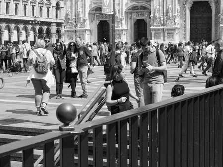 MILAN, ITALY - CIRCA APRIL 2018: People in Piazza Duomo in front of Duomo di Milano (meaning Milan Cathedral) in black and whiteのeditorial素材