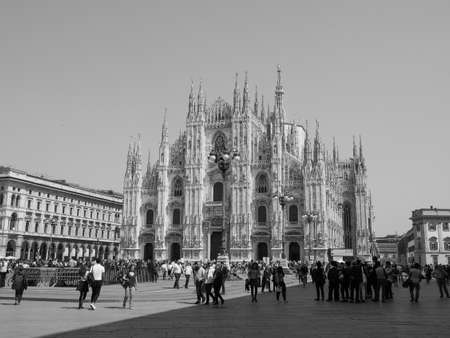 MILAN, ITALY - CIRCA APRIL 2018: People in Piazza Duomo in front of Duomo di Milano (meaning Milan Cathedral) in black and whiteのeditorial素材
