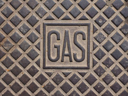 Steel Gas manhole grid in the streetの写真素材