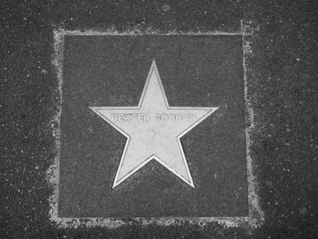 BOLOGNA, ITALY - CIRCA SEPTEMBER 2017: Marble star on the sidewalk dedicated to jazz musician Dexter Gordon in black and whiteのeditorial素材