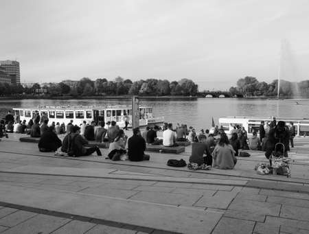 HAMBURG, GERMANY - CIRCA MAY 2017: People on Binnenalster (meaning Inner Alster lake) bank in black and whiteのeditorial素材