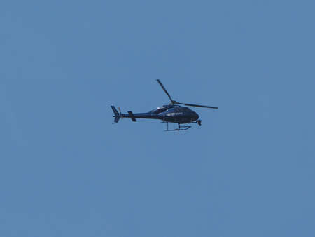 LONDON, UK - CIRCA JUNE 2018: BBC News helicopter hovering over London city centre to film live...