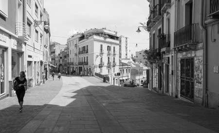 CAGLIARI, ITALY - CIRCA SEPTEMBER 2017: People in Castello quarter aka Casteddu e susu (meaning Upper Castle in Sard) old medieval town city centre in black and whiteのeditorial素材