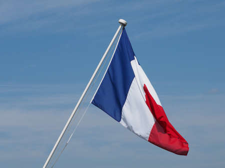 the French national flag of France, Europe over blue skyの写真素材