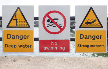 danger deep water, no swimming, danger strong currents signs