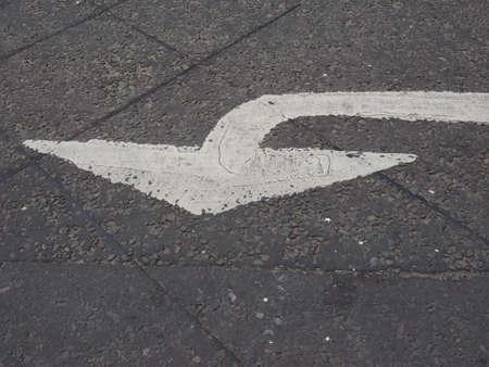 Regulatory signs, proceed in direction indicated by arrow traffic signの写真素材