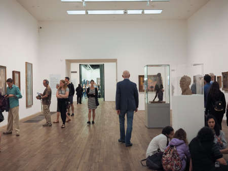 LONDON, UK - CIRCA JUNE 2018: Visitors at Tate Modern art gallery in South Bank power station