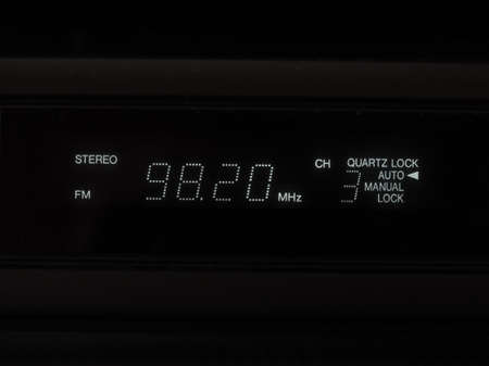 stereo FM radio tuner lcd display showing frequency of tuned radio station channelの写真素材