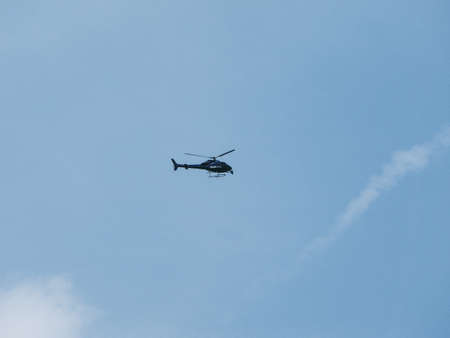 LONDON, UK - CIRCA JUNE 2018: BBC News helicopter hovering over London city centre to film live eventのeditorial素材