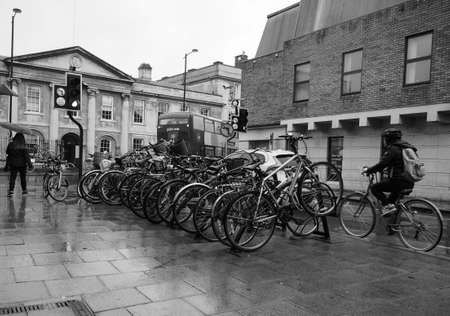 CAMBRIDGE, UK - CIRCA OCTOBER 2018: Rainy day in Cambridge city centre in black and white