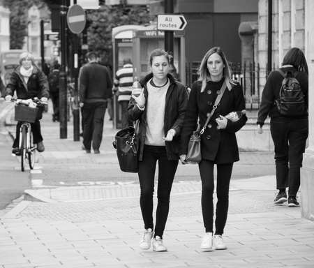 CAMBRIDGE, UK - CIRCA OCTOBER 2018: People in the city centre in black and whiteのeditorial素材