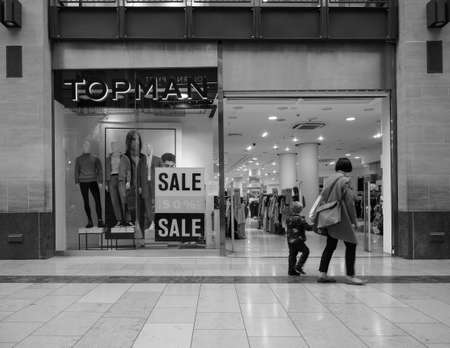 CAMBRIDGE, UK - CIRCA OCTOBER 2018: Topman shop at Grand Arcade shopping centre in black and whiteのeditorial素材
