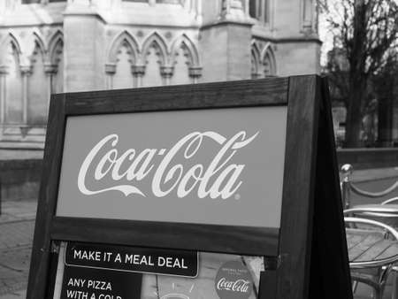 CAMBRIDGE, UK - CIRCA OCTOBER 2018: Coca Cola sign in black and white