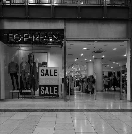 CAMBRIDGE, UK - CIRCA OCTOBER 2018: Topman shop at Grand Arcade shopping centre in black and whiteのeditorial素材