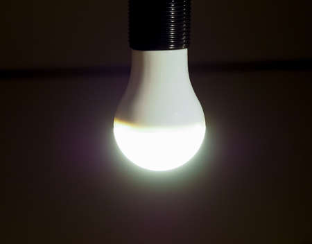 A LED Light Emitting Diod lamp bulb over dark backgroundの写真素材
