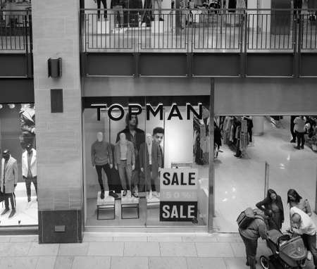 CAMBRIDGE, UK - CIRCA OCTOBER 2018: Topman shop at Grand Arcade shopping centre in black and whiteのeditorial素材