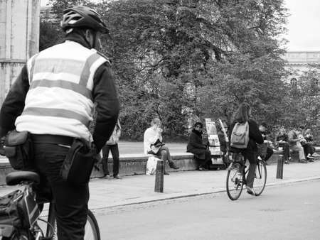 CAMBRIDGE, UK - CIRCA OCTOBER 2018: civil enforcement officer at work in black and whiteのeditorial素材