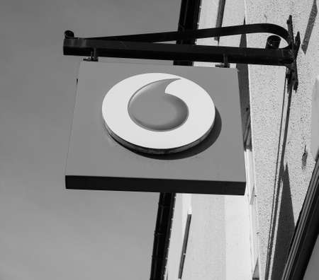 ELY, UK - CIRCA OCTOBER 2018: Vodafone storefront sign in black and whiteのeditorial素材