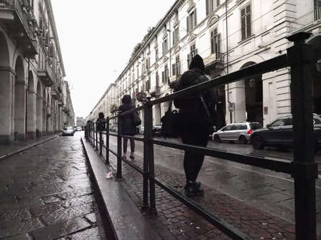 TURIN, ITALY - CIRCA NOVEMBER 2018: People at bus stop in Via Poのeditorial素材
