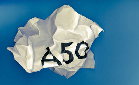 Crumpled paper ball with word A50 representing the growing request to revoke Article 50 to stop Brexit and remain in the EU, after the ECJ decision and May deal failureの写真素材