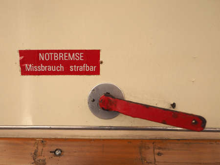 Notbremse, Missbrauch strafbar (meaning Emergengy brake, abuse punishable) sign on German tram