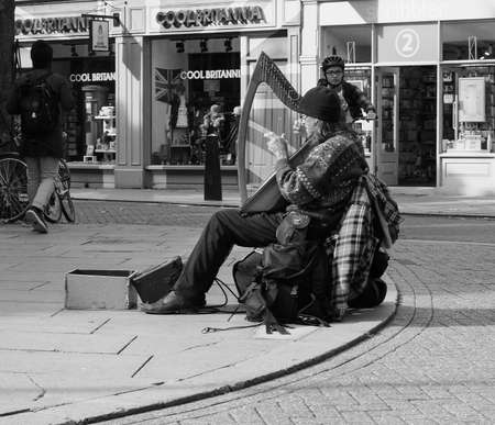 CAMBRIDGE, UK - CIRCA OCTOBER 2018: People in the city centre in black and whiteのeditorial素材
