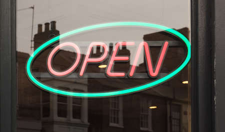 neon open sign in a shop windowの写真素材