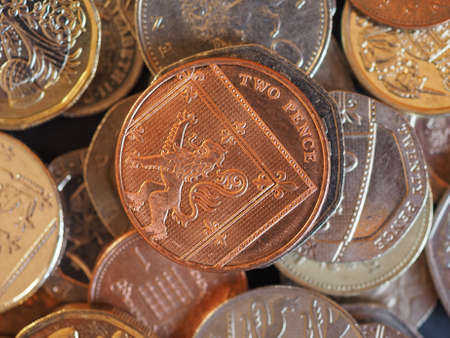 Pound coins money (GBP), currency of United Kingdom useful as a backgroundの写真素材