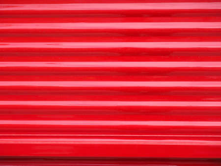 red corrugated steel metal texture useful as a backgroundの写真素材