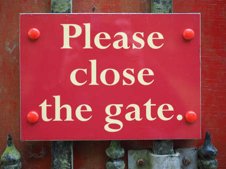please close the gate sign on a doorの写真素材