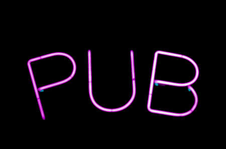 Pub sign written with pink neon light