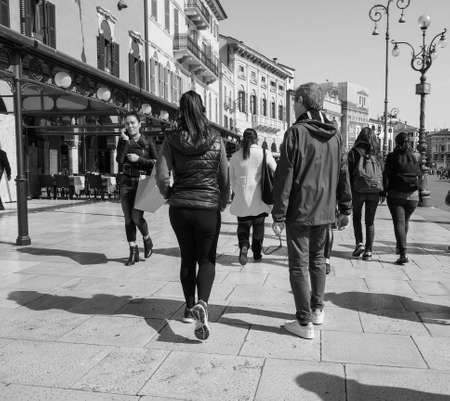 VERONA, ITALY - CIRCA MARCH 2019: People in the city centre in black and whiteのeditorial素材
