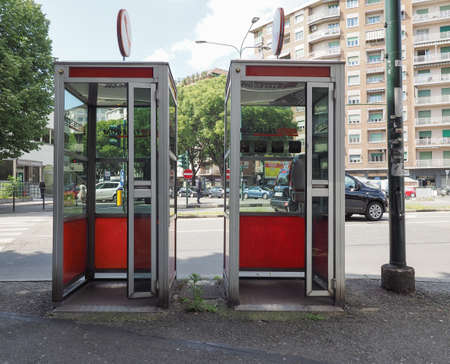 TURIN, ITALY - CIRCA MAY 2019: Vintage Telecom red phone boxesのeditorial素材