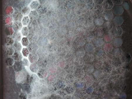 dust and poplar pollen inside a desktop computer case attracted by fan