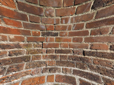 curved red brick wall texture useful as a background