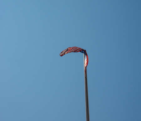 the American national flag of United States of America over blue sky