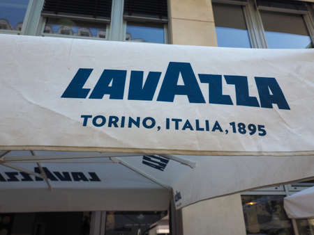 BERLIN, GERMANY - CIRCA JUNE 2019: Lavazza Torino Italia 1895 coffee brand sign on bar umbrellaのeditorial素材