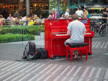 BERLIN, GERMANY - CIRCA JUNE 2019: man playing piano in Potsdamer Platzのeditorial素材