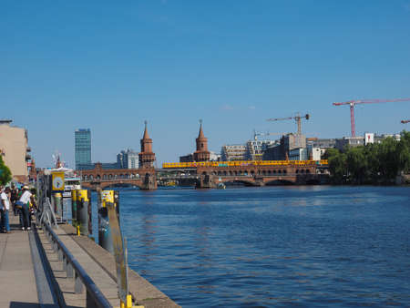 BERLIN, GERMANY - CIRCA JUNE 2019: Oberbaumbruecke (Oberbaum Bridge) double deck bridge crossing River Spreeのeditorial素材