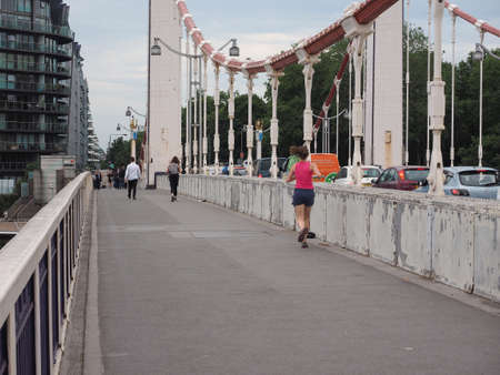 LONDON, UK - CIRCA JUNE 2019: Chelsey Bridge crossing River Thamesのeditorial素材