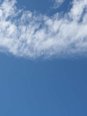 stormy dark blue sky with clouds useful as a background, with copy space