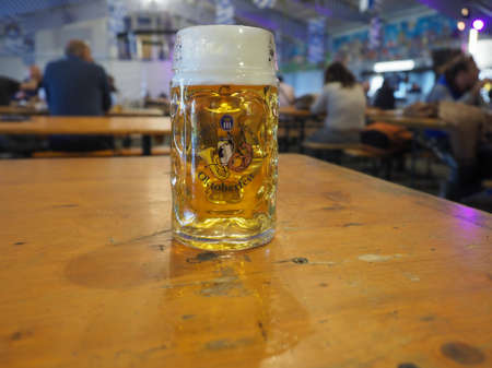 TURIN, ITALY - CIRCA OCTOBER 2019: Hofbraeu Oktoberfest beer glassのeditorial素材