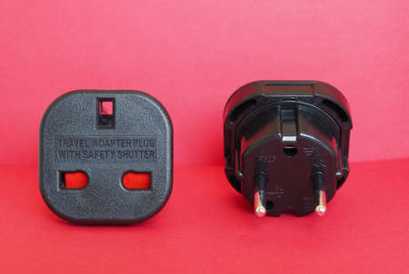 Type G (British) socket to Type F (Schuko) plug travel adapter with safety shutterの写真素材