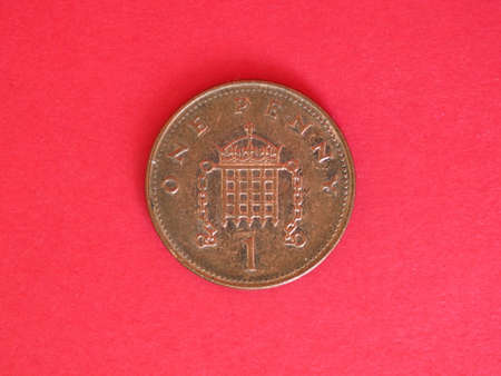 1 penny coin money (GBP), currency of United Kingdom over red background