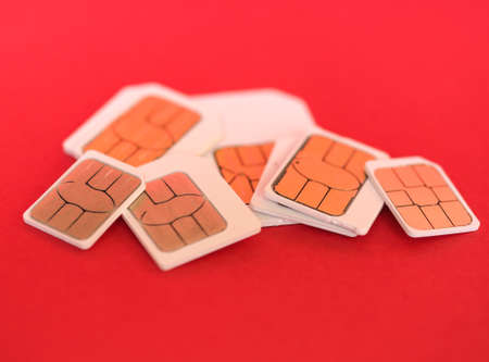 Many mini micro and nano sim cards for mobile telephoneの写真素材
